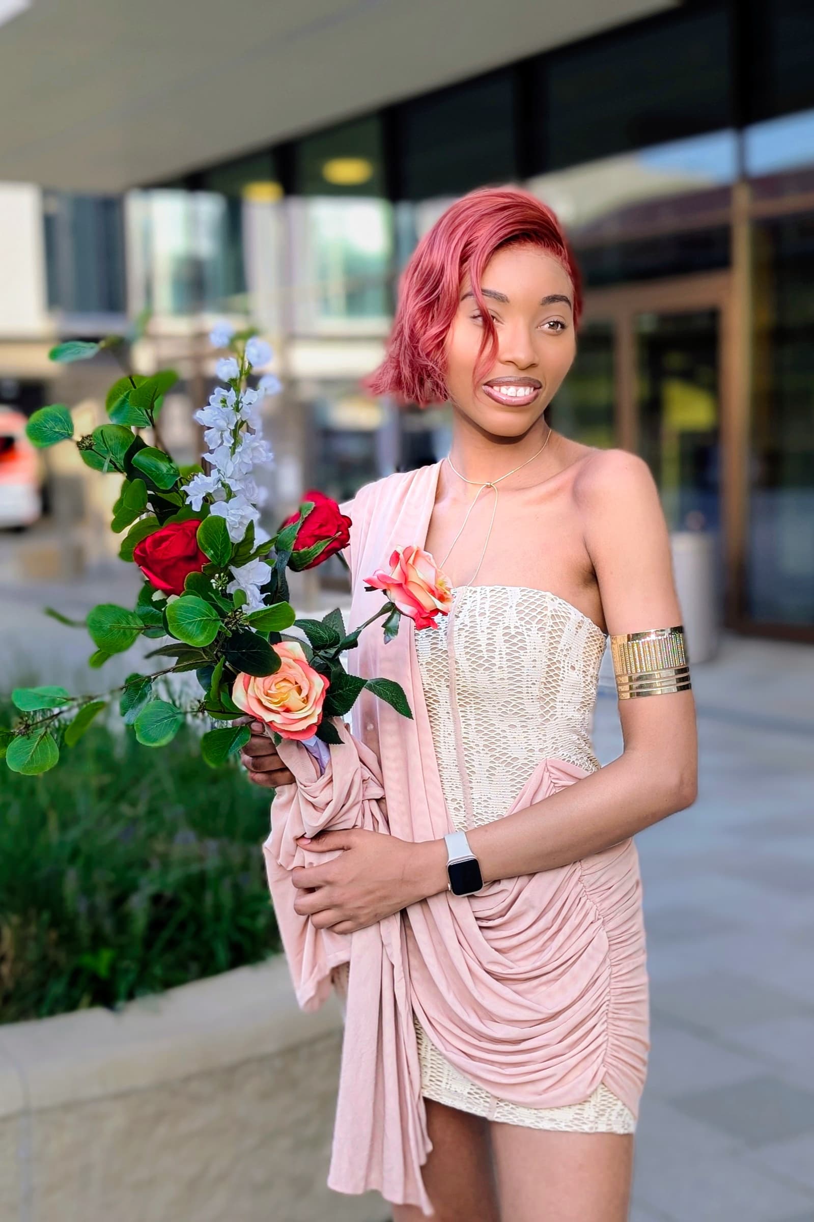 Pink hair and white sequin dress with a bouquet of roses