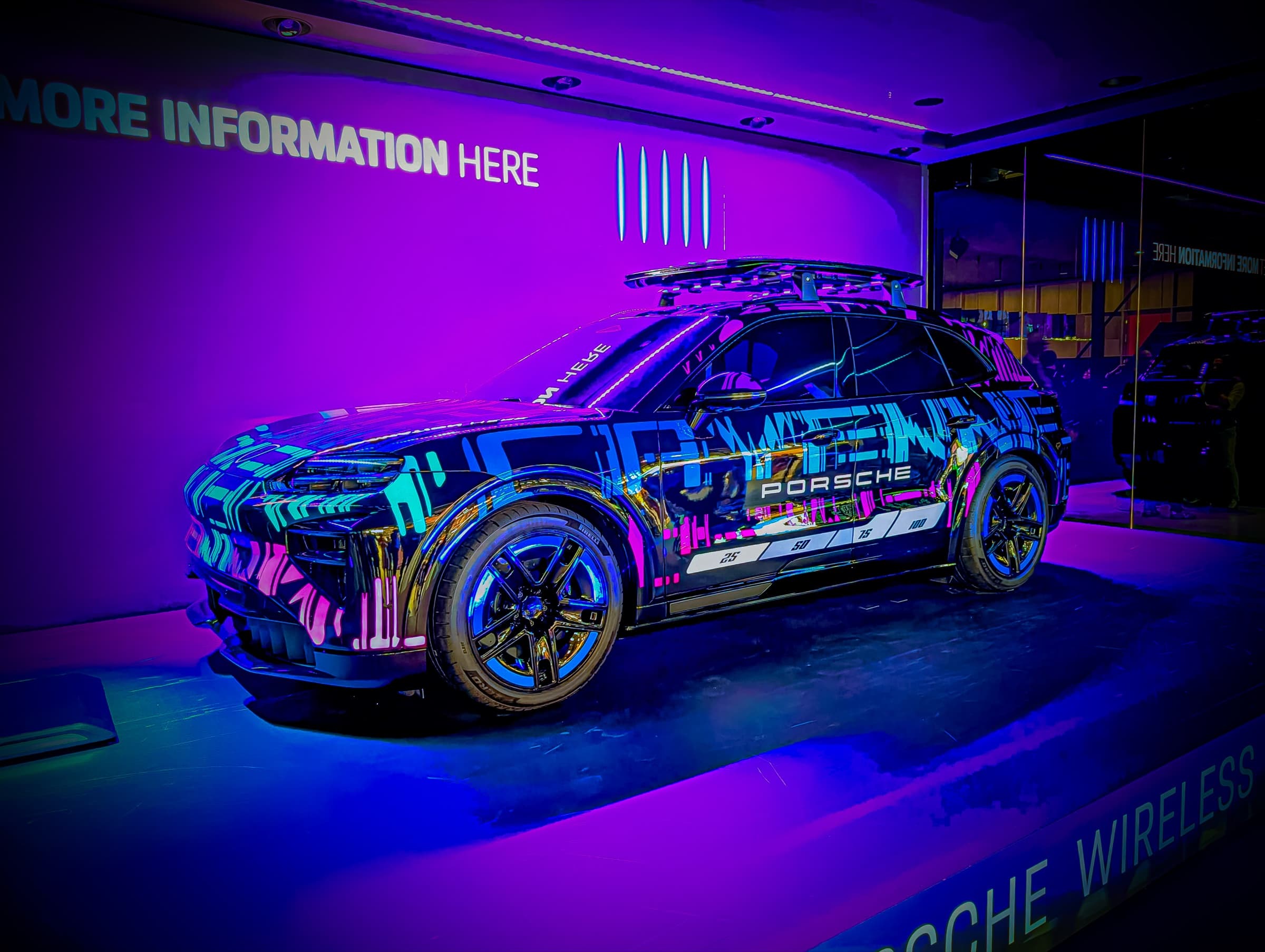 Porsche prototype with neon graffiti wrap, magenta lighting
